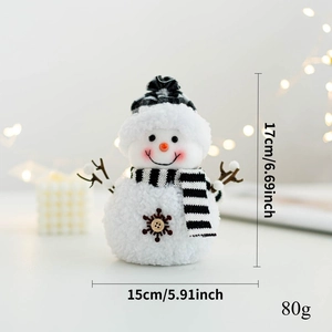 Detailed view of plush snowman decoration showing plaid scarf and product dimensions