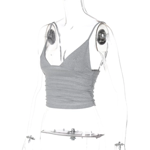 Detail of grey V-neck cropped camisole featuring stylish ruched fabric and slim fit design