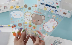 Close-up of waterproof cartoon PET stickers featuring cute bear and cloud characters