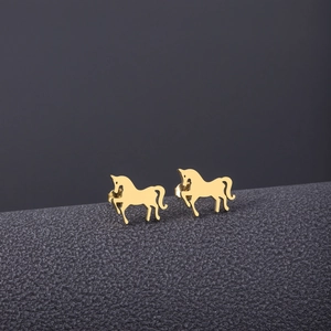 Detail view of golden hollowed horse stud earrings made of polished stainless steel