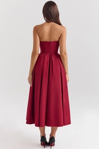 Detailed back view of a burgundy satin corset midi dress with invisible zipper closure