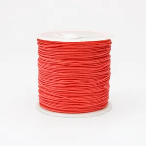Close-up of 0.8mm red nylon thread spool for DIY jewelry making and knotting crafts