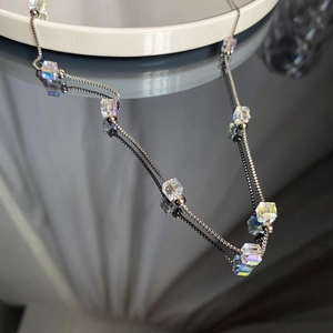 Minimalist titanium steel necklace featuring iridescent crystal sugar cubes and silver beads