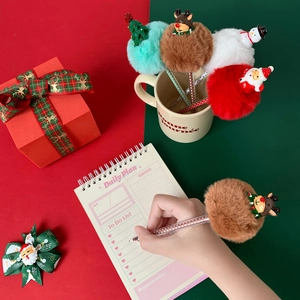Christmas ballpoint pens with plush pom-poms, featuring Santa, reindeer, and snowman designs