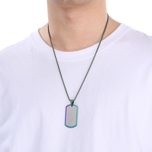 Detail of silver rectangle dog tag pendant with rainbow plated edges on a metal chain