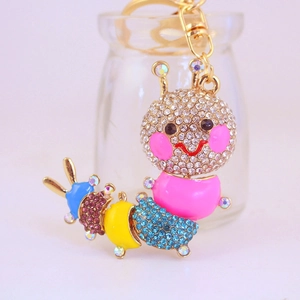 Colorful rhinestone caterpillar keychain in gold finish with sparkling enamel details