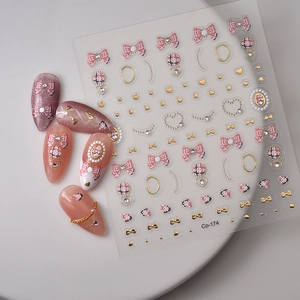 5D embossed nail art stickers with pink bows, hearts, and golden 3D relief details