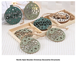 Close-up of laser-cut wooden Christmas pendants with Merry Christmas text and hemp rope
