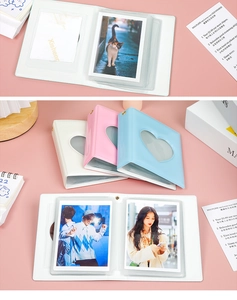 Inner transparent plastic slots of the heart cutout mini album showing photo card storage