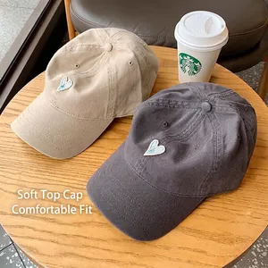 Soft top baseball caps in beige and charcoal gray with heart embroidery and cotton texture