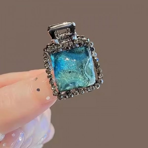 Elegant ice blue resin hair claw clip with rhinestones and square crystal design