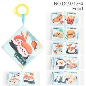 Detail of baby soft cloth book with yellow hanging ring and cartoon food cognition pages