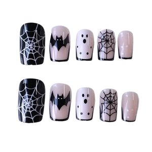 Halloween press-on nails with spider web and bat designs in medium square shape