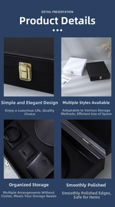 Close-up of velvet jewelry box with metal clasp and multi-grid storage compartments
