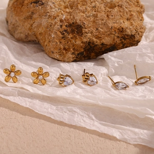 Detail of 18K gold plated stainless steel stud earrings with marquise zircon stones