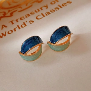 Vintage geometric earrings with navy and seafoam marble texture in gold metal frames