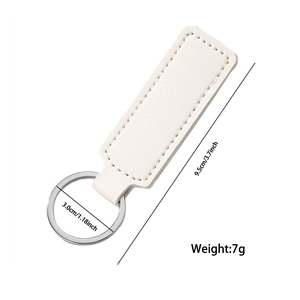 White PU leather car keychain with metal ring and dimension markings on a white background