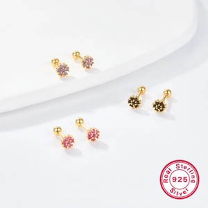 Macro detail of 925 sterling silver flower earrings with colorful zircon stones