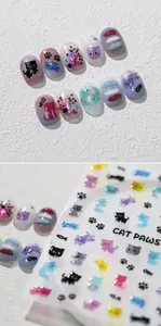 3D embossed cartoon cat nail art stickers featuring colorful paw prints and fish designs