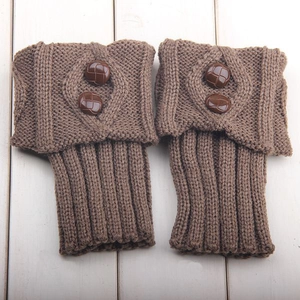 Brown knit leg warmers with diamond pattern and vintage buttons on wooden background