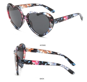 Detail view showing 45-degree and back angles of heart-shaped floral sunglasses