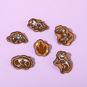 Detailed set of 6 dinosaur skeleton fossil enamel pins on soft purple background