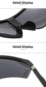Close-up of matte black cycling glasses with wide nose pads and reinforced metal hinges