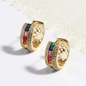 Close-up of golden hoop earrings featuring colorful rectangle-cut zircon stones