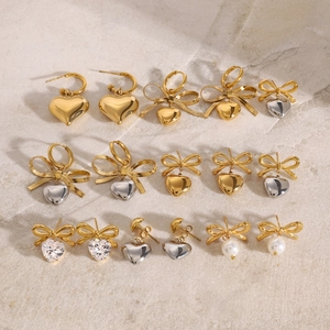Detailed assortment of stainless steel heart and bow earrings with zircon and pearls