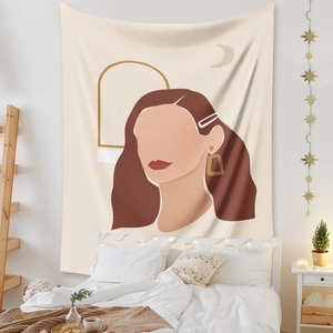 Detail of bohemian wall tapestry featuring abstract female portrait and moon in bedroom