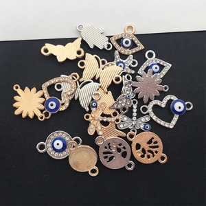 Assorted gold and silver evil eye charms with rhinestones for DIY jewelry making