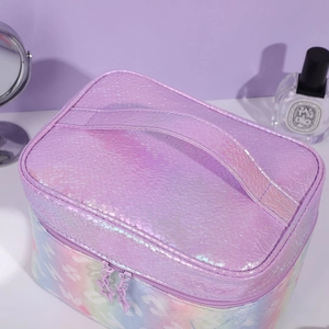 Macro shot of purple snakeskin texture and star-shaped zipper on high-capacity makeup bag