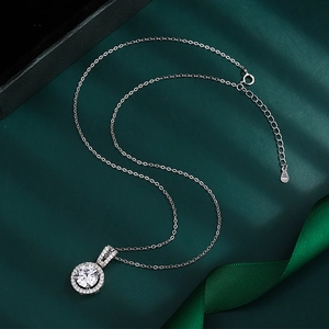 Macro detail of S925 sterling silver halo necklace with a 2-carat zirconia pendant