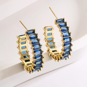 Elegant 18K gold plated C-shaped hoop earrings with blue rectangular zircons on white stand