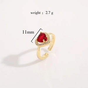 Macro shot of 11mm red heart-shaped gemstone ring with gold-plated brass band and 2.7g weight