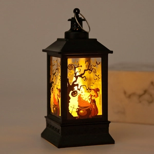 Detail of Halloween lantern with witch pattern and warm LED candlelight effect