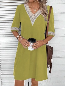 Olive green V-neck dress with white lace trim and short sleeves in a loose casual style