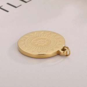 Minimalist round gold stainless steel sun totem pendant charm with textured sunburst pattern