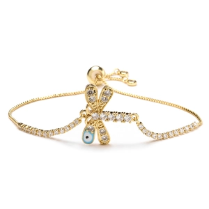 Gold dragonfly charm bracelet with evil eye detail and sparkling white cubic zirconia