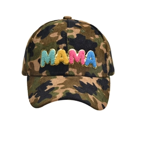 Detail of MAMA colorful chenille patches and gold sequins on camouflage baseball cap