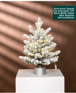 Detailed view of 45cm artificial flocked Christmas tree with warm white lights and silver base