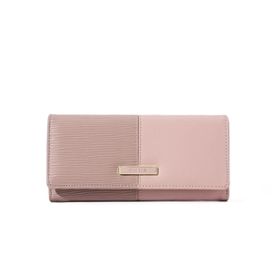 Detail of long patchwork wallet with pink waves texture and gold logo clasp