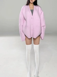 Light pink V-neck knit cardigan with buttons and pockets in a cozy loose style