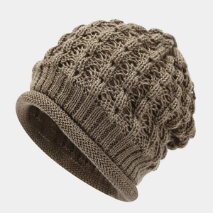 Detailed close-up of the hollow knit texture and ribbed edge of this brown knitted beanie