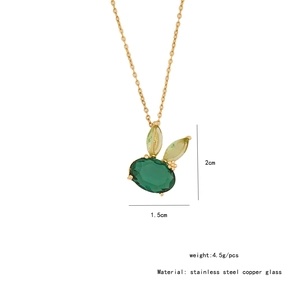 Detail of gold bunny pendant with green glass stone and measurement specifications