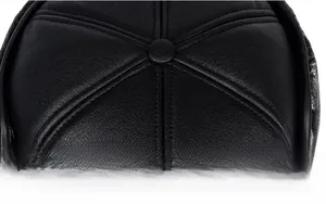 Close-up of the crown button and stitching on this black PU leather baseball cap