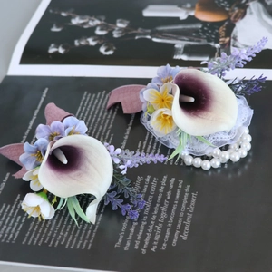 Calla lily boutonniere and wrist corsage set with purple flowers and faux pearls