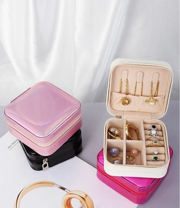Internal layout of portable PU leather jewelry box showing ring slots and necklace hooks
