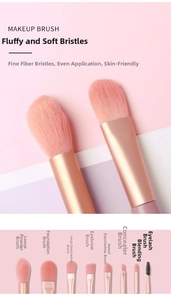 Detail view of 8 champagne gold makeup brushes with soft pink fiber bristles