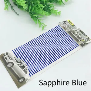 Macro detail of 3mm royal blue self-adhesive acrylic rhinestones for DIY decoration
